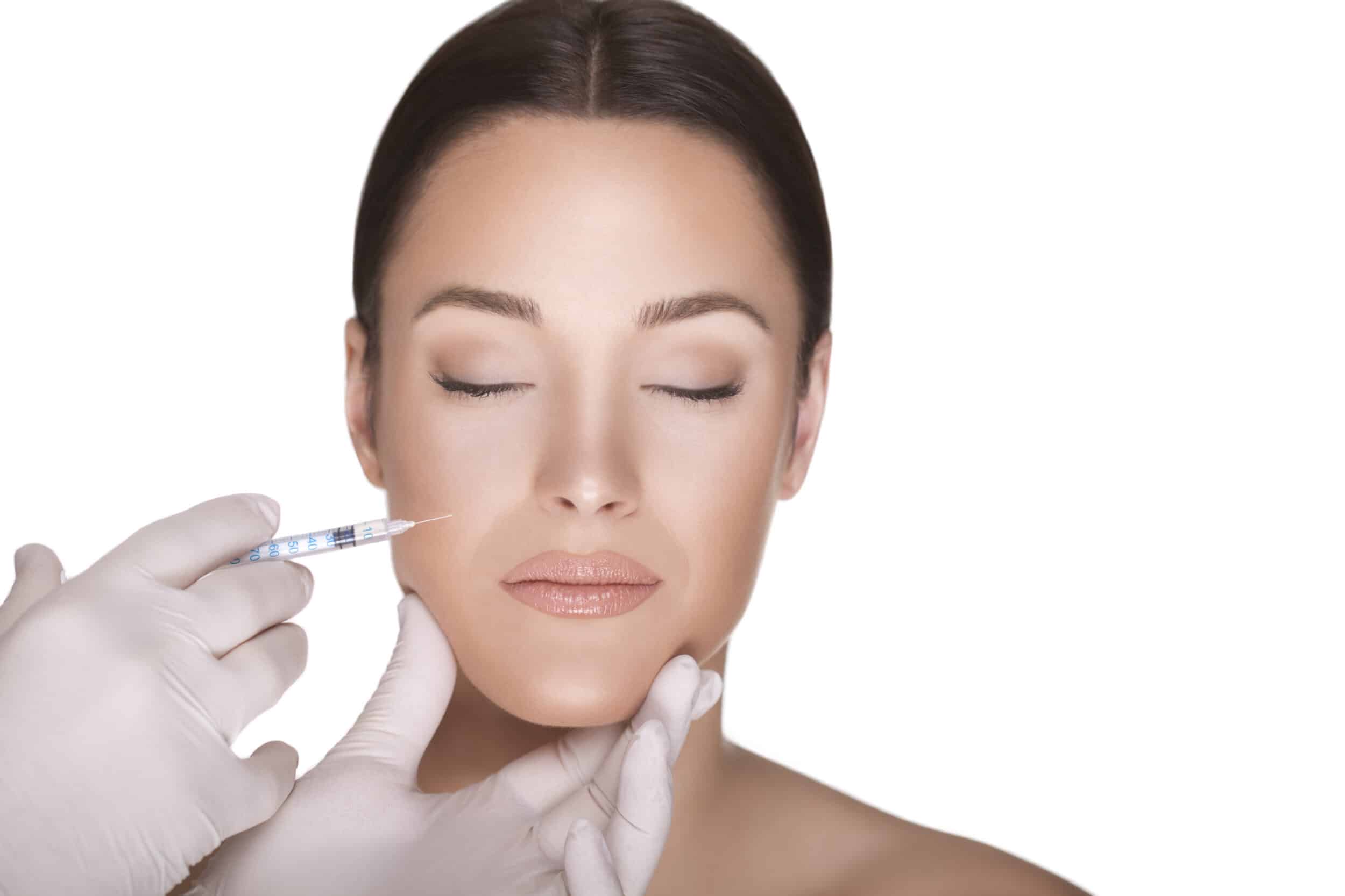 Doctor injects RHA filler into a patient's cheek